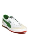 Other kicks will envy these streamlined PUMA sneakers, featuring lush green suede stripes and color-pop neon soles.