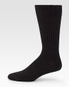 Sophisticated solid ribbed in remarkably soft, virgin merino wool.Mid-calf height80% wool/20% nylonMachine washMade in Italy