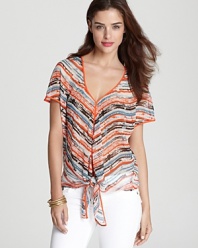 Imbued with a vibrant print, this Sam & Lavi top can be styled two ways -- tied at the hem or cascading down.