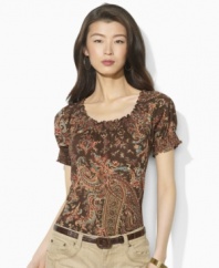 Imbued with breezy bohemian style, a soft cotton jersey top gets a romantic update in a paisley print with a smocked neckline and cuffs, from Lauren by Ralph Lauren.