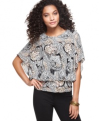 This pretty petite top by Style&co. features a vibrant paisley print and flattering blouson-style silhouette. Play up  its shape with a pair of slim-fitting pants and heels.