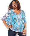 Get a striking look with INC's butterfly sleeve plus size top, flaunting an embellished sublimated print.