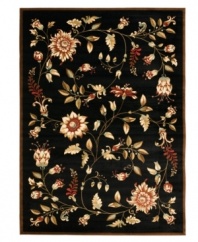 An intricate display of cascading florals creates this purely elegant Lyndhurst area rug from Safavieh. Crafted in Turkey of soft polypropylene, this rug radiates timeless allure with the added convenience of easy-care construction. (Clearance)
