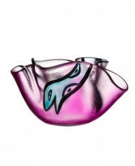 A friendly face slithers in between the folds of magenta-colored glass in this handcrafted Happy Going bowl, a fun surprise for modern interiors. Designed by Ulrica Hydman-Vallien for Kosta Boda.