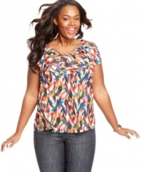 Brighten up your style with Eyeshadow's short sleeve plus size top, showcasing a vivid print.